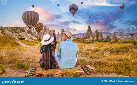Cappadocia Turkey During Sunrise Couple On Vacation In The Hills Of