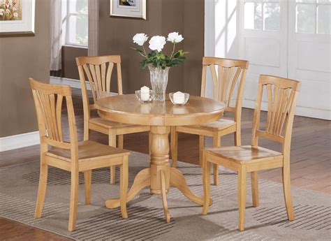The oval dining room table fits at least 6 kitchen dining chairs, and the stand design allows the table and chairs set to easily fit in a variety of dining area measurements. 5PC SMALL KITCHEN DINING SET IN OAK FINISH http://stores ...