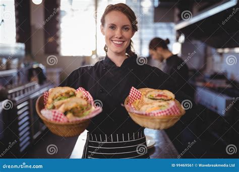 Portrait Of Smiling Waitress Serving Fresh Burgers At Coffee Shop Stock Image Image Of Barista