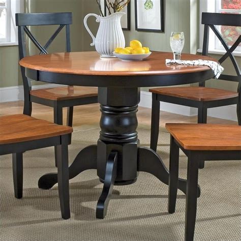 Our solid teak dining tables come in a variety of styles + shapes (oval, rectangular, round, square). Home Styles Round Pedestal Casual Dining Table in Black ...