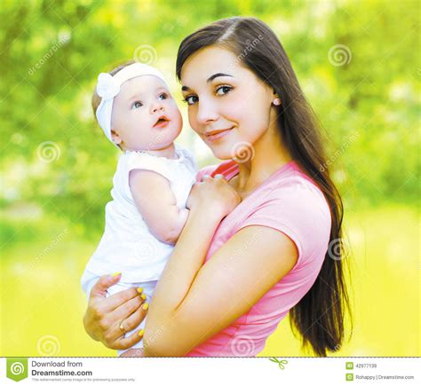 Happy Mom And Child In The Summer Sunny Day Stock Image