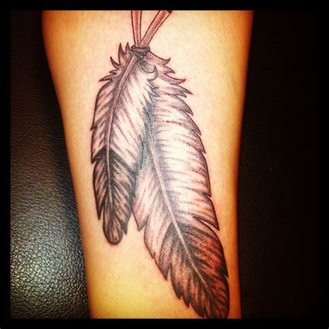 feather tattoo on calf tattoos feather tattoo indian feather tattoos