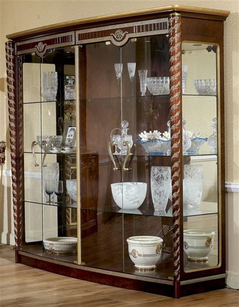 Fashioned from glass and hardwoods, these curio cabinets are ideal for displaying heirlooms, fine china, glassware and other collectibles. Walnut Burl/Glass 4-Door Curio Cabinet | eBay