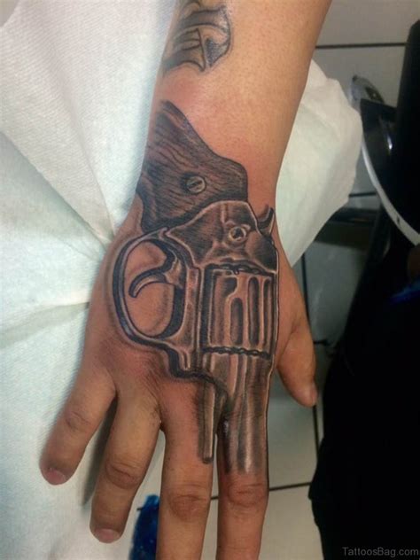 Click share button below please like to download first and download button will be display. 28 Funky Gun Tattoos On Hand