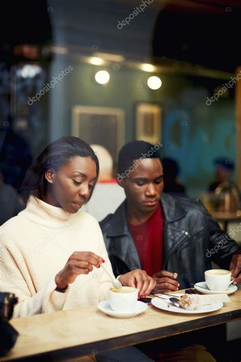 Two Young Friends Talk And Drink Coffee In Cafe Good Friends Enjoying