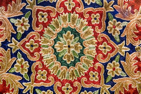 What kind of rug with floral wallpaper. Closeup of a Persian Rug Background Texture | www ...