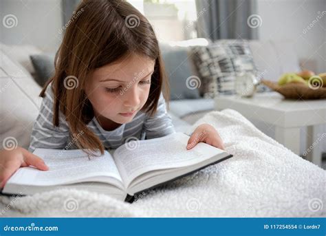 Cute Young Girl Reading Book At Home Stock Photo Image Of Literature