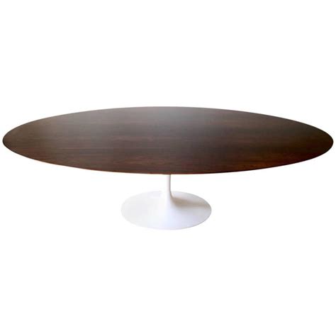 Planning on restoring this and i'm trying to find more information about it. Rare 96" Saarinen Walnut Dining Table at 1stdibs