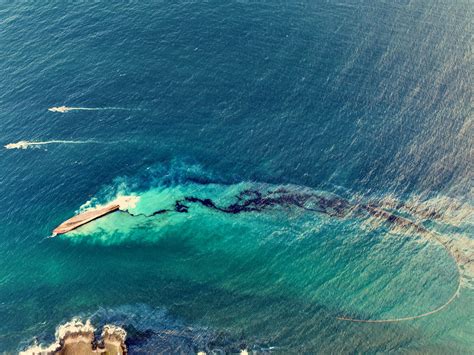 Trinidad And Tobago Cleans Up Beaches After Overturned Vessel Spills Oil