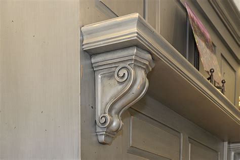 White kitchen cabinets remain massively popular among home remodelers, and rightfully so. Mantle hood corbel in Knotty Alder with Sawyer Smoke Stack finish. | Kitchen cabinets in ...