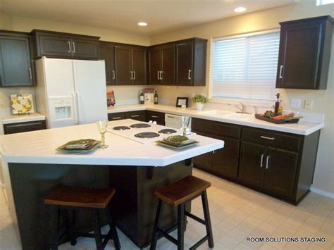 How can i update my kitchen cabinets without replacing them? Home Staging Tip: Dated Oak Cabinets? Update them with Paint!