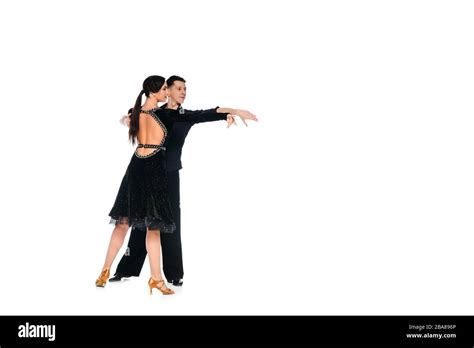 Elegant Young Couple Of Ballroom Dancers In Black Dress And Suit