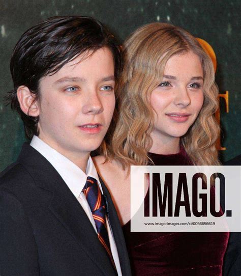 Asa Butterfield L And Chloe Grace Moretz Arrive For The French Premiere Of The Film Hugo Cabret In