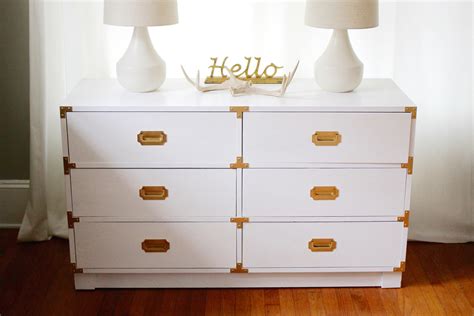 Once dry, attach the hardware and pair with a painted plywood plank for an oversize desk that would make even don draper opt for sleek white paint and classic gold pulls to create a nightstand that will seamlessly blend in with any bedroom. Restoring a Classic: Campaign Dresser in White and Gold ...