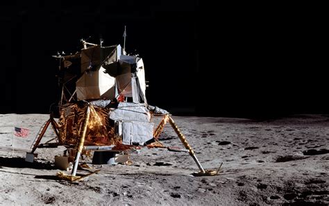 An Astronaut Standing On The Surface Of The Moon With His Equipment In