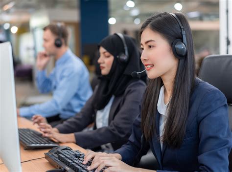 Happy Smiling Operator Asian Woman Customer Service Agent With Headsets