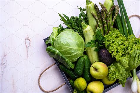 Various Green Vegetables And Fruits Featuring Green Vegetables And