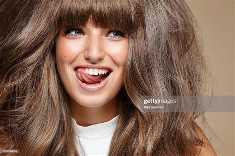 Beautiful Young Woman Licking Her Teeth Photo Getty Images