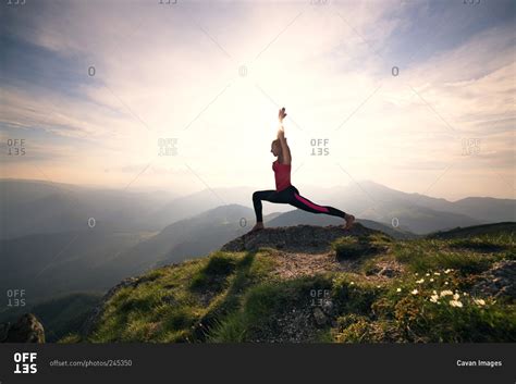 Woman In Yoga Pose On Mountain Peak Stock Photo Offset