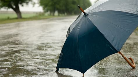 Umbrella On The Road Under Rain Stock Footage Video