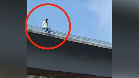 on cam man hangs self from bridge at kalwa rescued city times of india videos