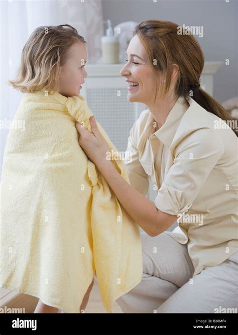 Mother Drying Daughter With Towel Stock Photo Alamy