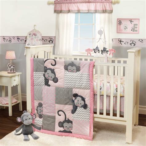 A deer, fox, raccoon and bunny stroll through the forest and are accented with a mini floral print and a softwood grain print in a girly colour palette of light pinks. Girls Monkey Crib Bedding