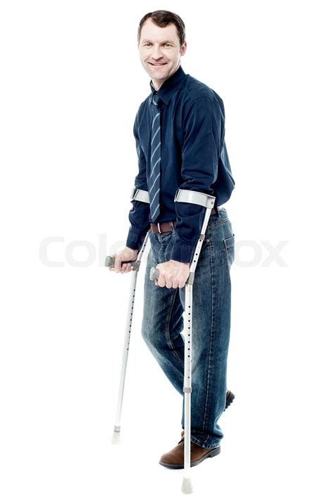 Man Walking With Crutches Isolated On White Stock Image Colourbox