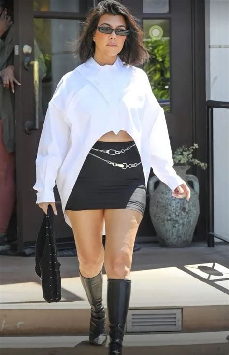 kourtney kardashian wears baggy pantsuit over scant bikini in sardinia artofit