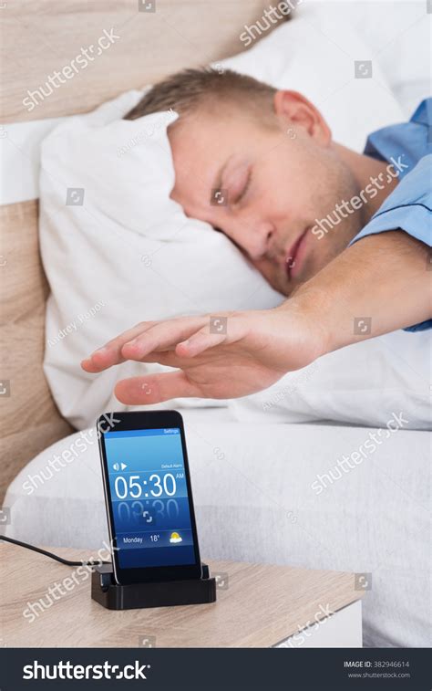 Man Lying On Bed Snoozing Alarm Stock Photo 382946614 Shutterstock