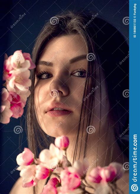 Gorgeous Young Girl With Colorful Flowers Studio Portrait Stock Photo