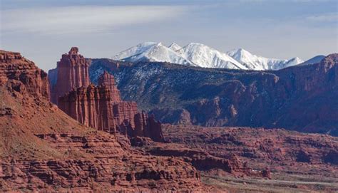 Moab Utah Red Rocks And Snowcapped Mountains Roads