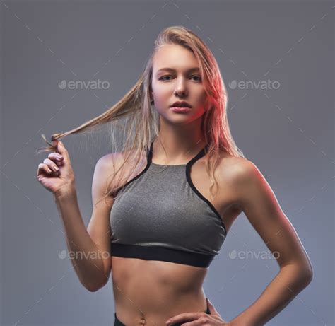 Sexy Slim Blonde Girl In A Sportswear Posing In A Studio Stock Photo