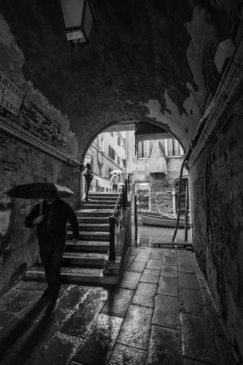 Man With Umbrella Walking In Tunnel Photo Free Black And White Image