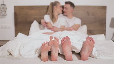Feet Of A Couple Hugging In Bed Free Stock Video
