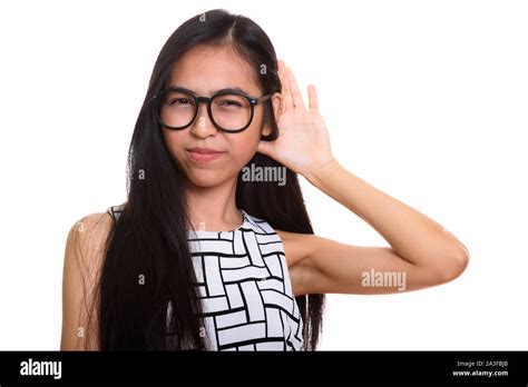 Young Asian Teenage Nerd Girl Listening Carefully Stock Photo Alamy