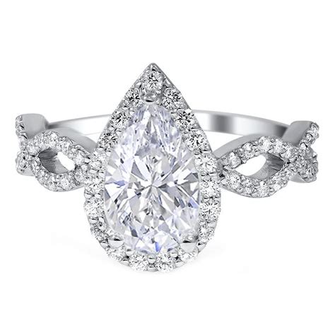 Pear shaped engagement rings use an elegant and sophisticated gemstone cut that forms a hybrid between the marquise and oval cuts. Pear Shape Halo Diamond Engagement Ring with Infinity Sign Band | Engagement ring shapes ...