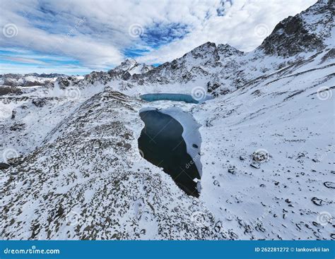 Three Mountain Frozen Turquoise Lakes In The Snowy Mountains Top View
