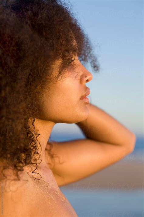 Profile Portrait Of Young Black Woman With Curly Hair By Stocksy