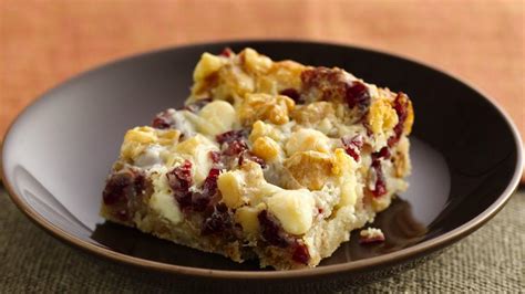 90 christmas cookie recipes that'll make the holidays merry. Winter Harvest Cookie Bars recipe from Pillsbury.com