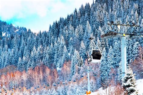 Ski Lift And Snow Covered Mountains Ak Bulak Kazakhstan Stock Image