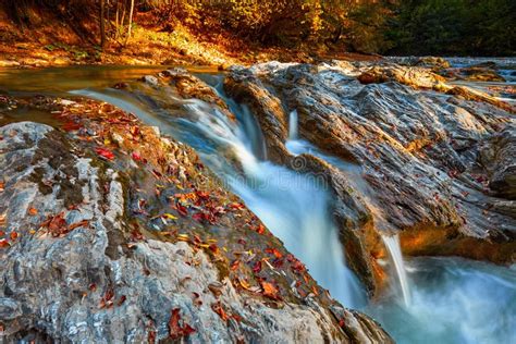 Beautiful Waterfall In Forest At Sunset Autumn Landscape Fallen