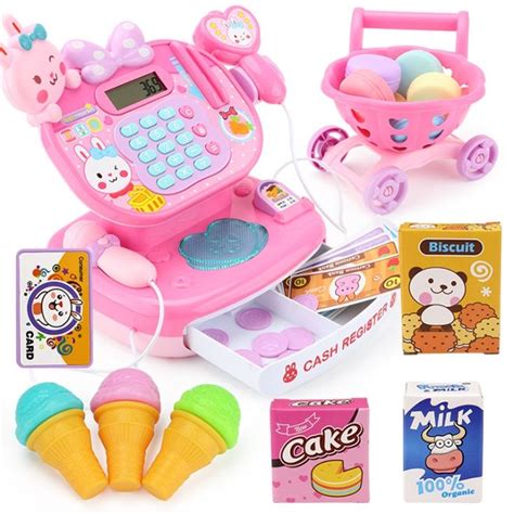 A Pink Toy Cash Register And Other Toys On A White Background With Clippings
