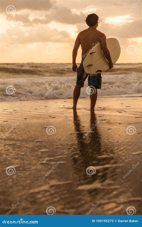 Male Man Surfer And Surfboard Sunset Sunrise Beach Stock Image Image Of