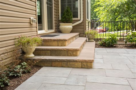 Eye Catching Paver Steps Against House To Improve Your Landscape