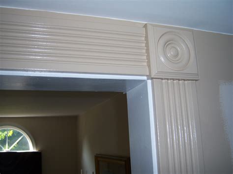 Begin installing the door casing with the top piece. Dressing Up an Archway with Fluted Casing and Rosettes ...