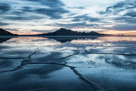 View Of The Bonneville Salt Flats Against Cloudy Sky During Sunset