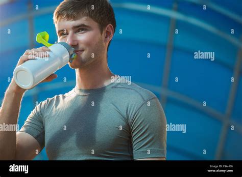 Athletic Young Man Drinking Water After Hard Training Stock Photo Alamy