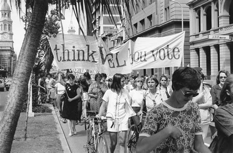 Women's day is celebrated on march 8th every year. In this image from the 1970s, women march in a parade for ...