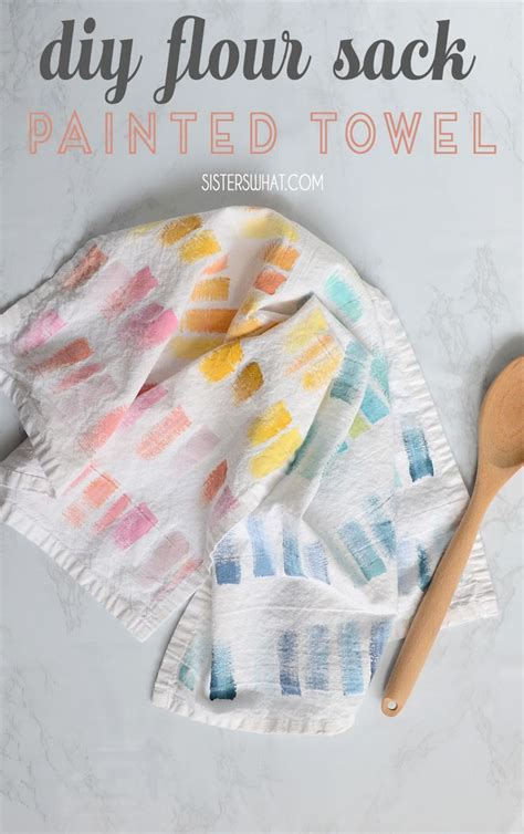 The Diy Flour Sack Is Painted Towel With A Wooden Spoon Next To It On A